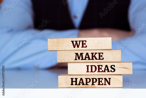 Wooden blocks with words 'We make ideas happen'.