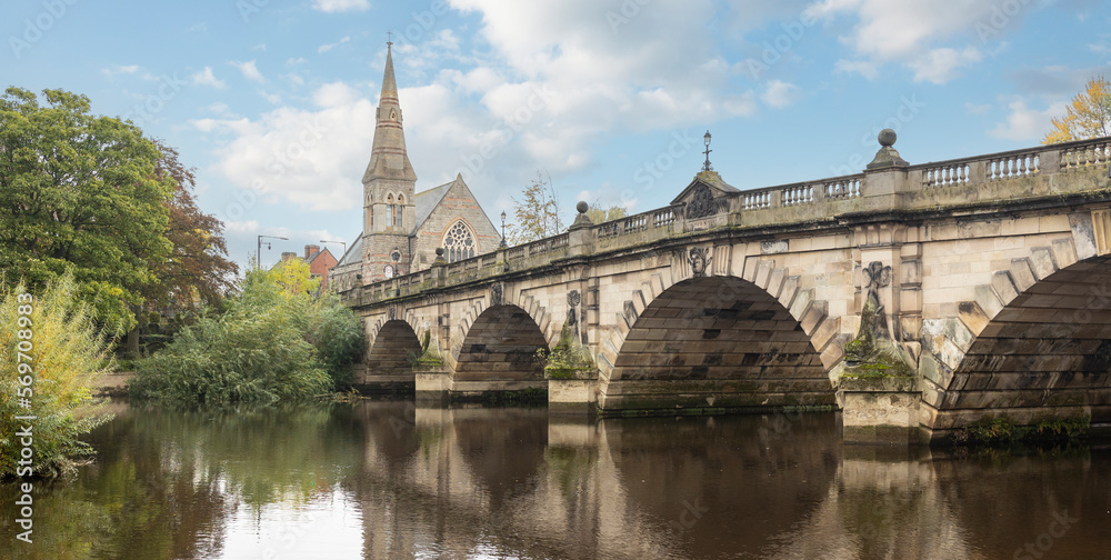 Wiew of the Engish Bridge and United Reformed Church across the River Severn in Shrewsbury in Shropshire, UK