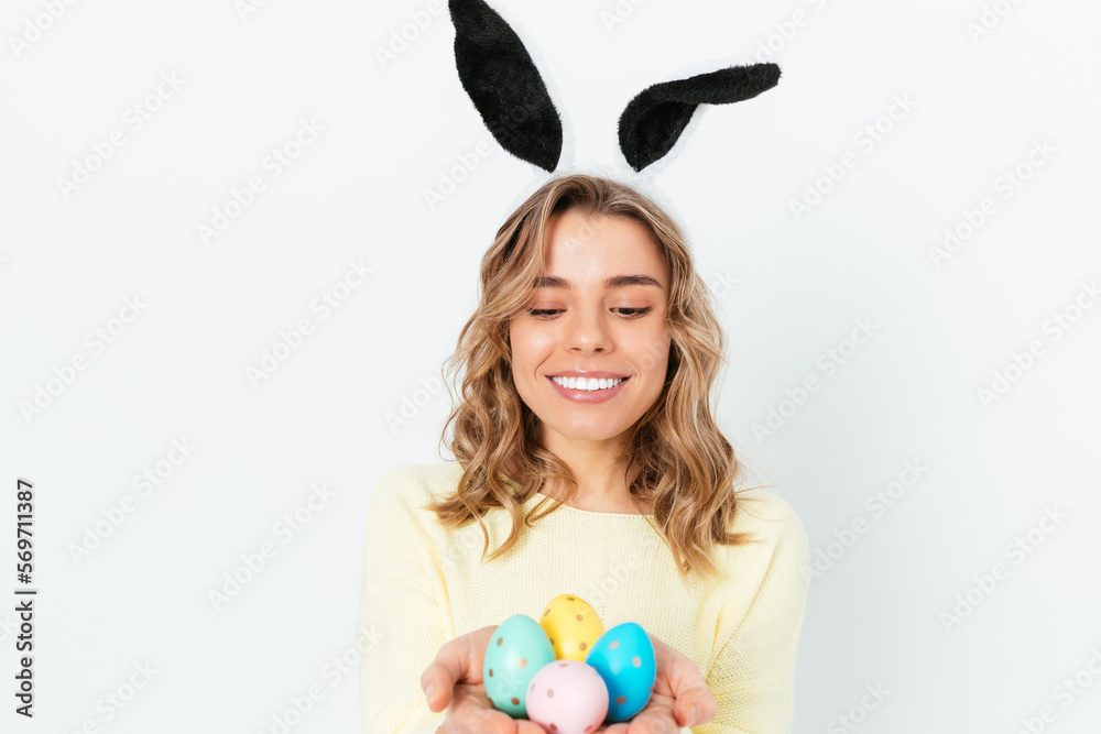 Surprised young woman wearing Easter bunny ears Surprised young woman wearing Easter bunny ears