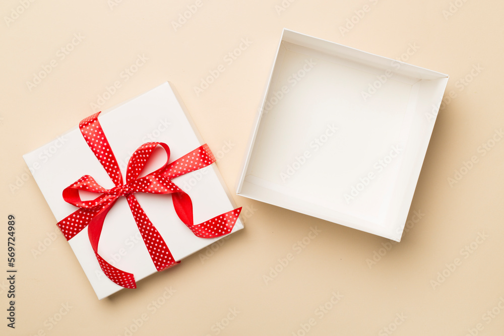 Open gift box on color background, top view Open gift box on color background, top view