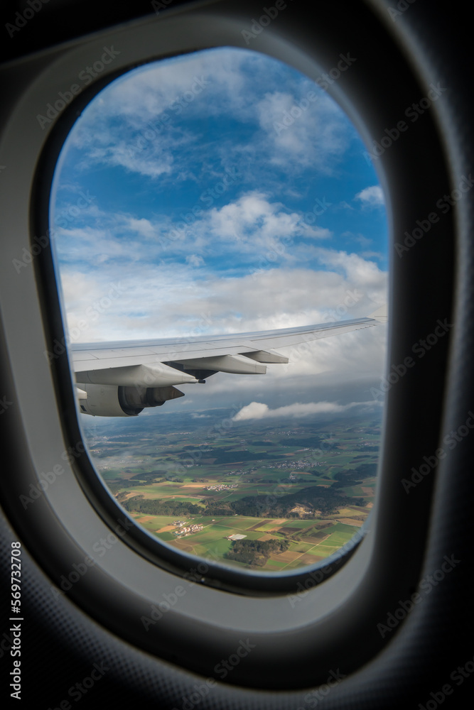 flying and traveling. Airplane interior or jet window with clouds and sky. Sky view from a high angle on the plane. 
