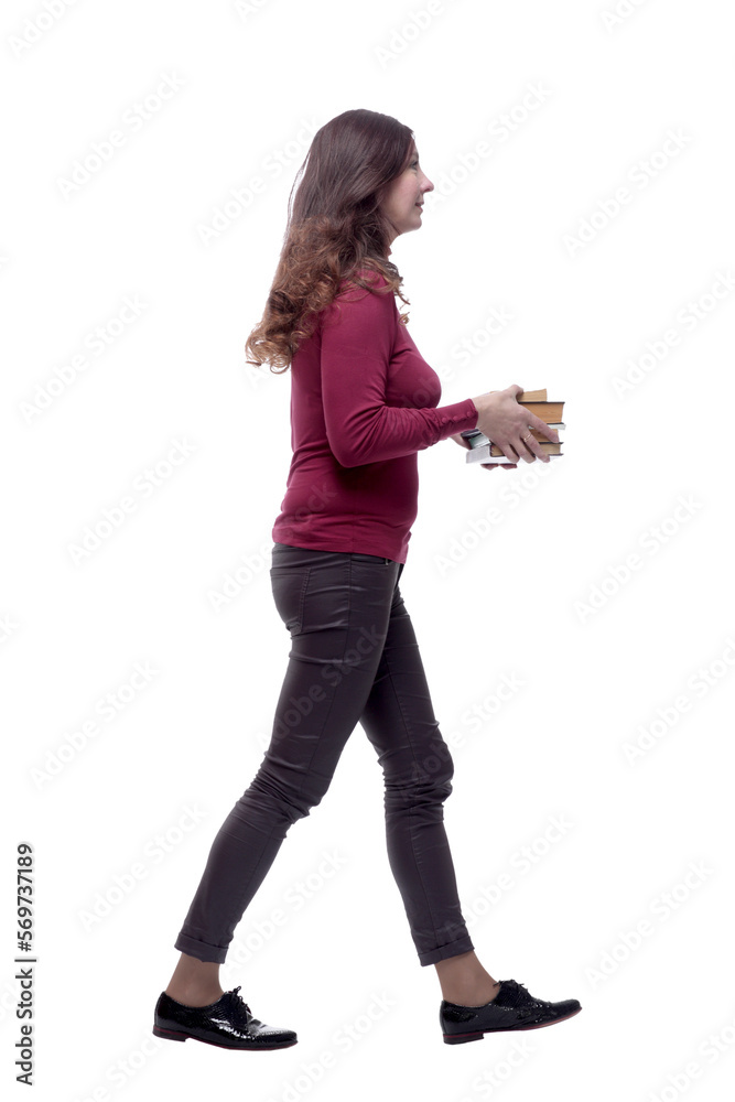 in full growth. happy young woman with a stack of books in full growth. happy young woman with a stack of books