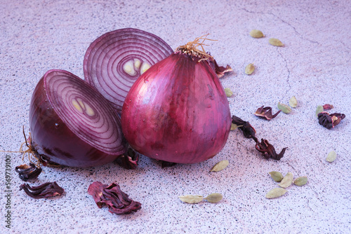 Copy space of purple onions on stone background