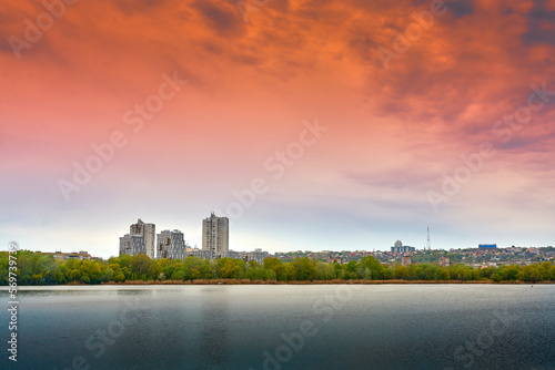 beautiful sunset over the city and the river © Stas