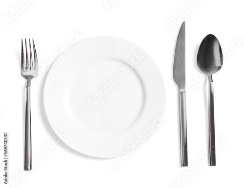Clean plate and shiny cutlery on white background  top view