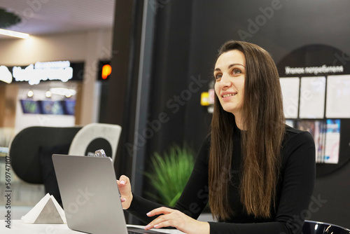 beautiful business woman in business center using tablet computer texting, walking in corporate office building, checking email messages online, successful executive woman.