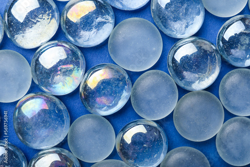 Glass stones on blue background