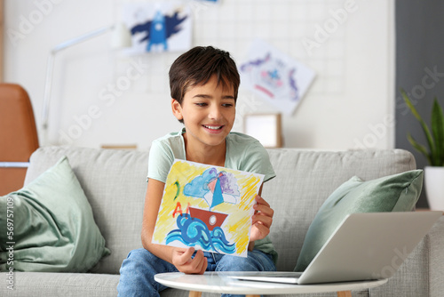 Little boy showing his draw...