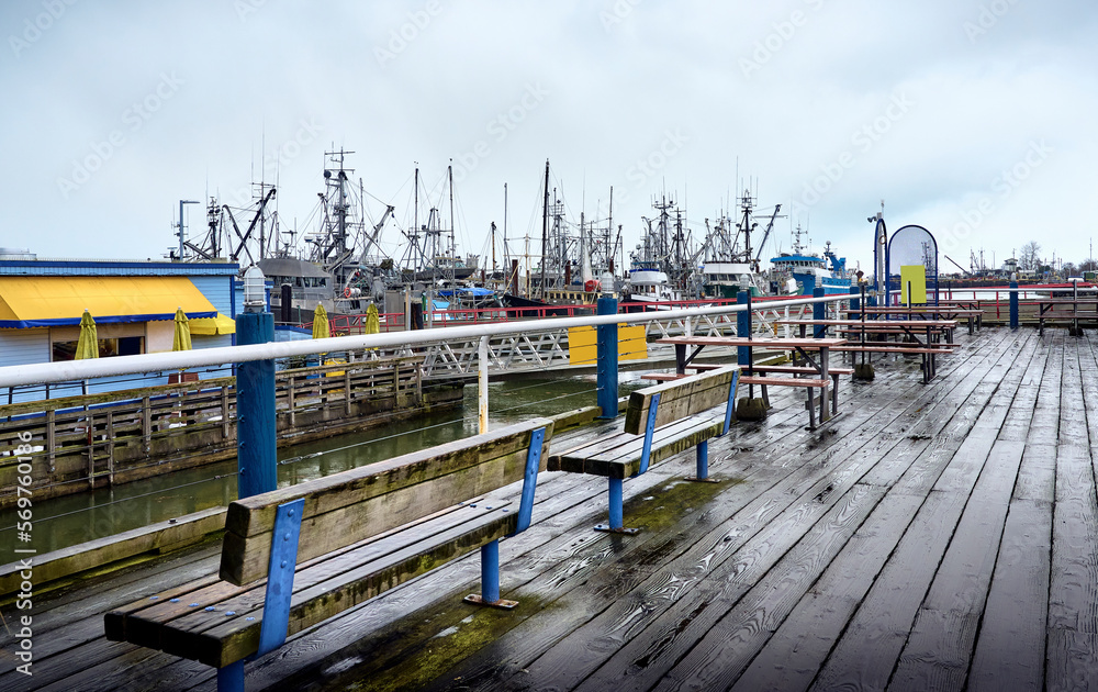 Waterfront Steveston Fisherman's Wharf. Fishing boats and sailboats in Steveston harbor. Richmond, BC, Canada Waterfront Steveston Fisherman's Wharf. Fishing boats and sailboats in Steveston harbor. Richmond, BC, Canada
