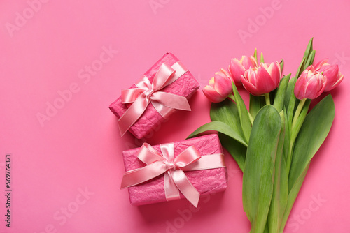 Gift boxes and beautiful tulip flowers on pink background. Hello spring © Pixel-Shot