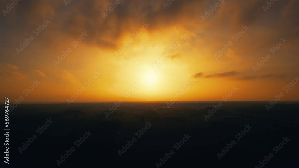 Sunset in the Yellow Sky. Timelapse. Big bright Yellow sun moves down. Awesome landscape of sky and silhouette of forest on the horizon. Amazing colors of the setting sun. Vibrant color. Time Lapse Sunset in the Yellow Sky. Timelapse. Big bright Yellow sun moves down. Awesome landscape of sky and silhouette of forest on the horizon. Amazing colors of the setting sun. Vibrant color. Time Lapse