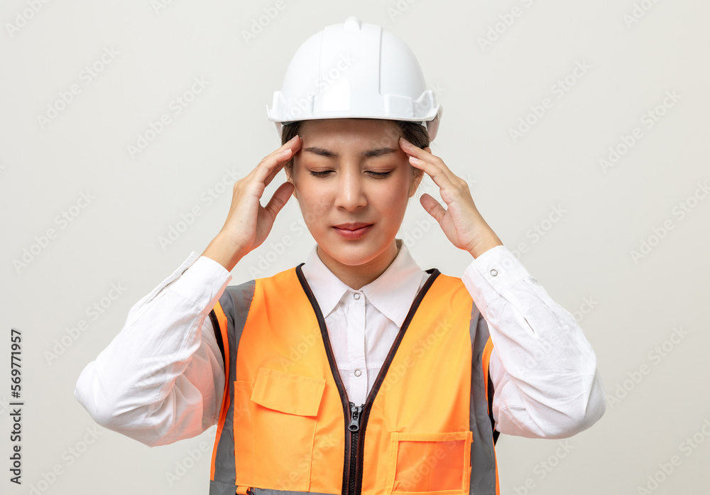 Asian engineer worker woman or architect with white safety helmet standing on isolated white background. Feeling depressed stress headache be tired from working health problems Asian engineer worker woman or architect with white safety helmet standing on isolated white background. Feeling depressed stress headache be tired from working health problems