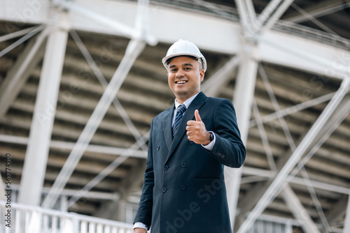 Wallpaper Mural Businessman manager owner real estate at modern office building. Cooperation of architect designer. Engineer with safety helmet checking at working construction site Torontodigital.ca