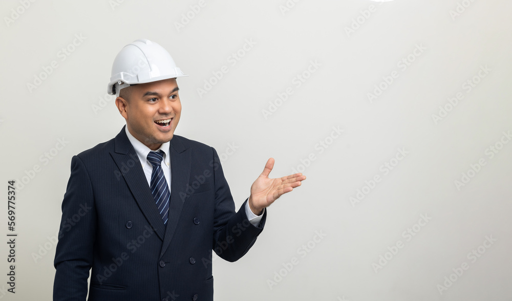 Businessman manager owner real estate pointing finger on isolated white background. Cooperation of architect designer. Engineer with safety helmet checking at working construction site