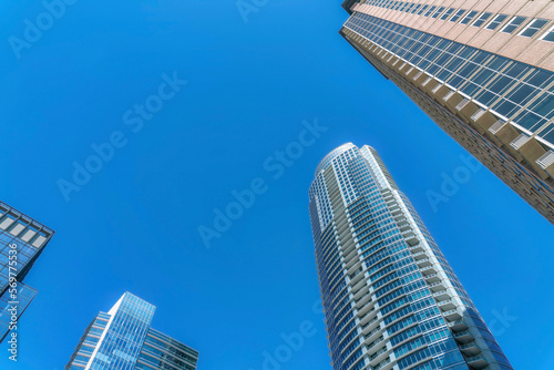 Scenic skyline in Austin Texas with modern residential buildings and blue sky. Exterior view of apartments and flats with glass facade and small balconies on a bright sunny day.