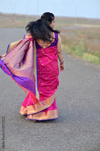 Walking indian bride in saree. Elegance look. Indian Bride in the Saree. Back side of wedding saree. Indian traditional dress. Maharashtra Bride. Maharashtra saree. woman walking on the street