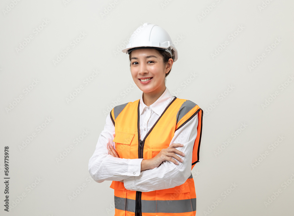 Asian engineer worker woman or architect with white safety helmet standing on isolated white background. Mechanic service factory Professional work job occupation in uniform.