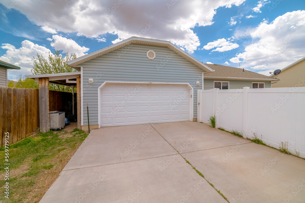 Utah Detached garage with clipped corner white garage door. Garage