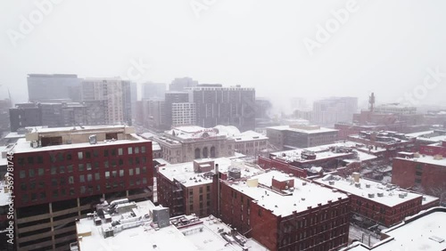 Denver City during Blizzard, Buildings and Union Station. Denver, Colorado. Aerial Drone footage. photo