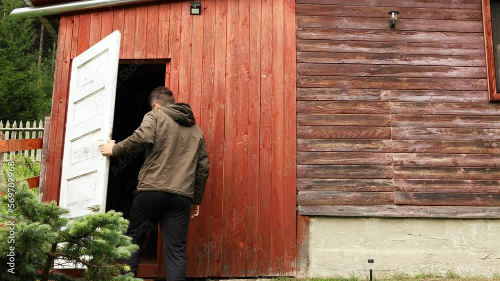 Man Coming From The Outside Enters The House From The Back Door. - wide Man Coming From The Outside Enters The House From The Back Door. - wide