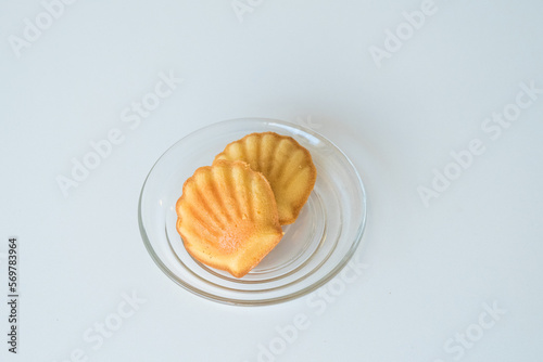 French madeleine cookies on plate,traditional French sweet dessert. photo