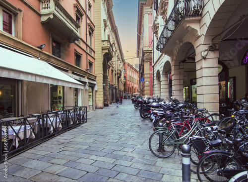 Fototapeta Naklejka Na Ścianę i Meble -  Bicycles and scooters parked in the historic centre of Bologna, Italy.