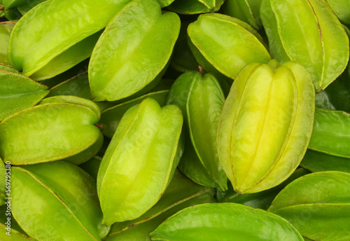 Schilderij op canvas Juicy star fruits or averrhoa carambola background.