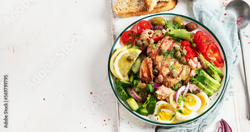 Tuna salad with lettuce, eggs and tomatoes.