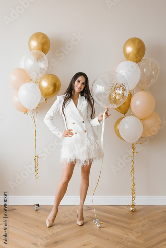 Obraz na plátne Young caucasian woman holding a balloon in her hands in honor of her thirtieth b