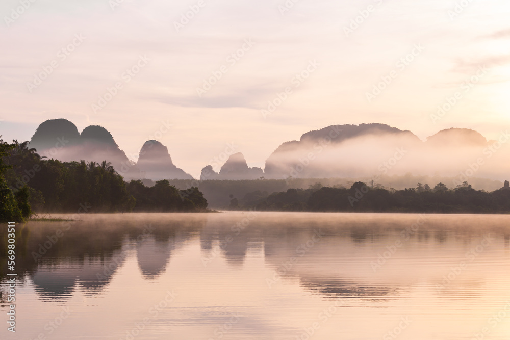 The Ban Nong Thale the natural scenery of the sunshine in the morning (mountains, lakes, trees, fog) at Krabi, Thailand.