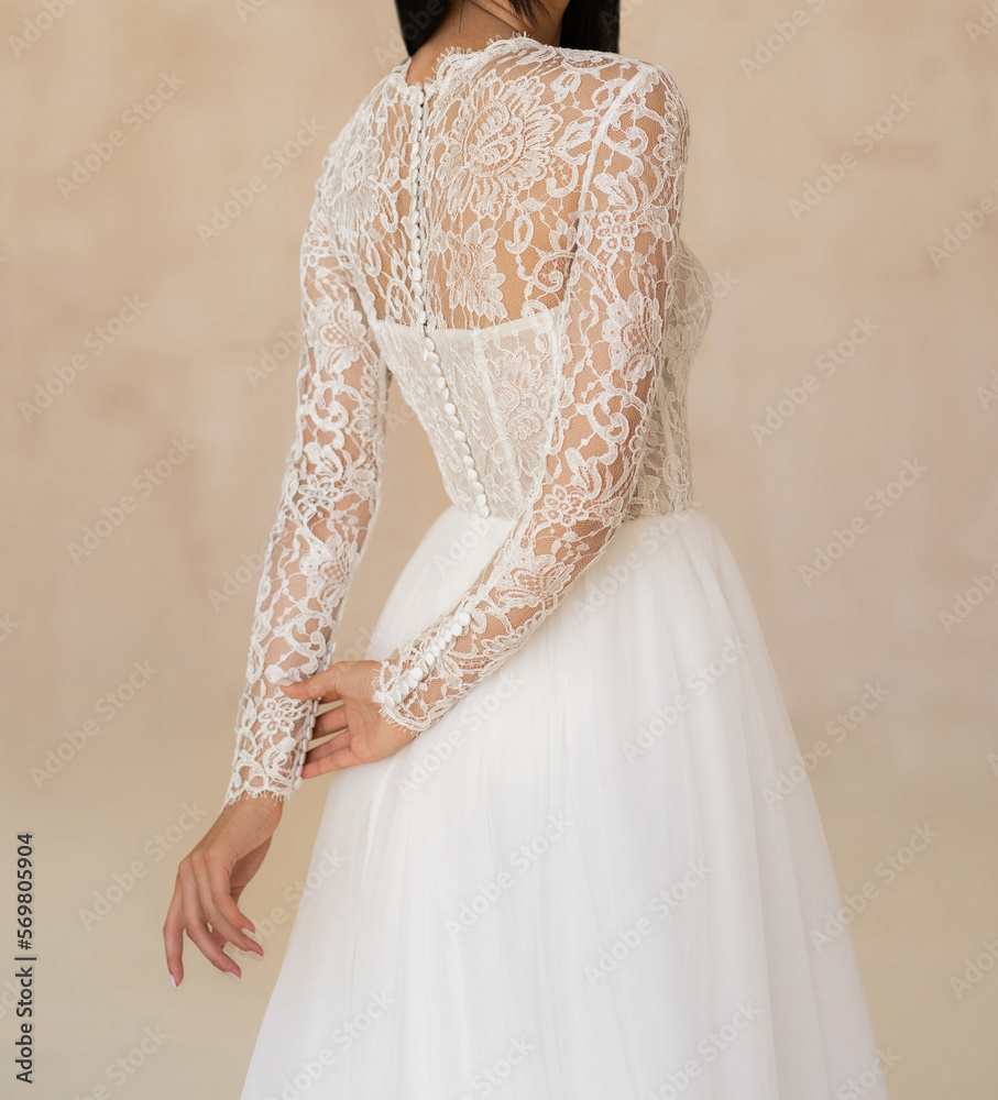 Back view of beautiful brunet bride in the white wedding dress ...