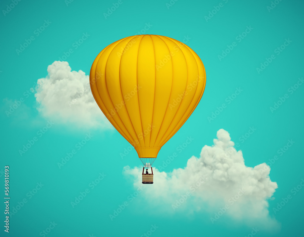 Obraz premium Hot air balloon flying above clouds.