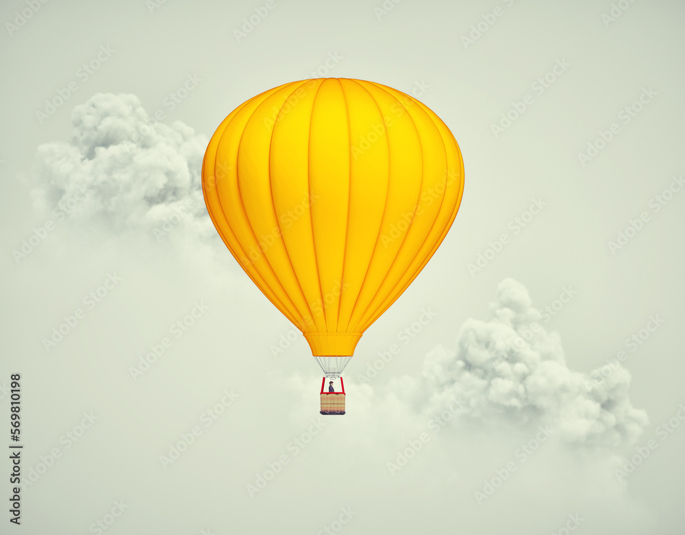 Obraz premium Hot air balloon flying above clouds.