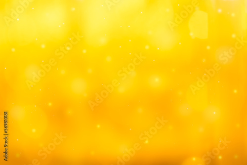 abstract photo of light gold, yellow abstract background with bokeh defocused lights. image is blurred and filtered