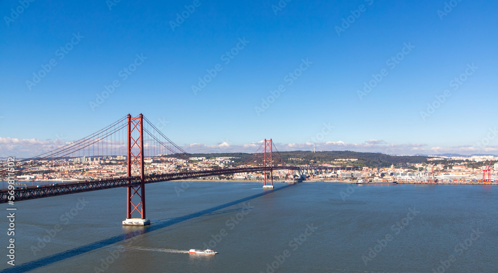 Landscape of the April 25 bridge over the Tagus river and the Lisbon  city  in the background