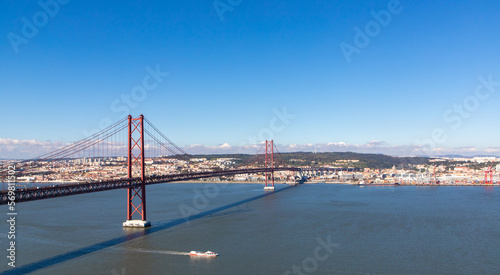 Landscape of the April 25 bridge over the Tagus river and the Lisbon city in the background