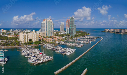 Meloy Channel at the Intracoastal Waterway against blue sky in Miami Florida. Aerial view of buildings and condominiums overlooking boats docked at the manmade inland water channel. © Jason