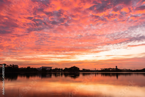 sunset nearly fall from the sky on the horizon reflected into the water