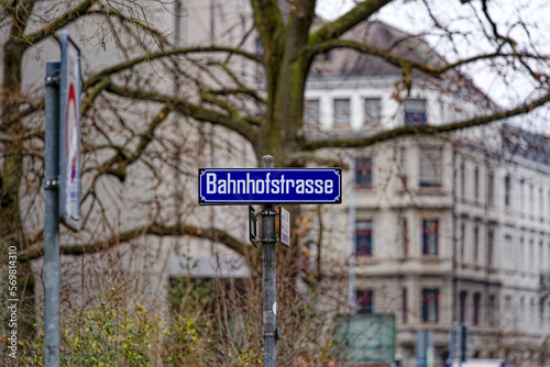 Street name sign of Bahnhofstrasse at City of Zürich on a gray and cloudy winter day. Photo taken February 8th, 2023, Zurich, Switzerland. photo