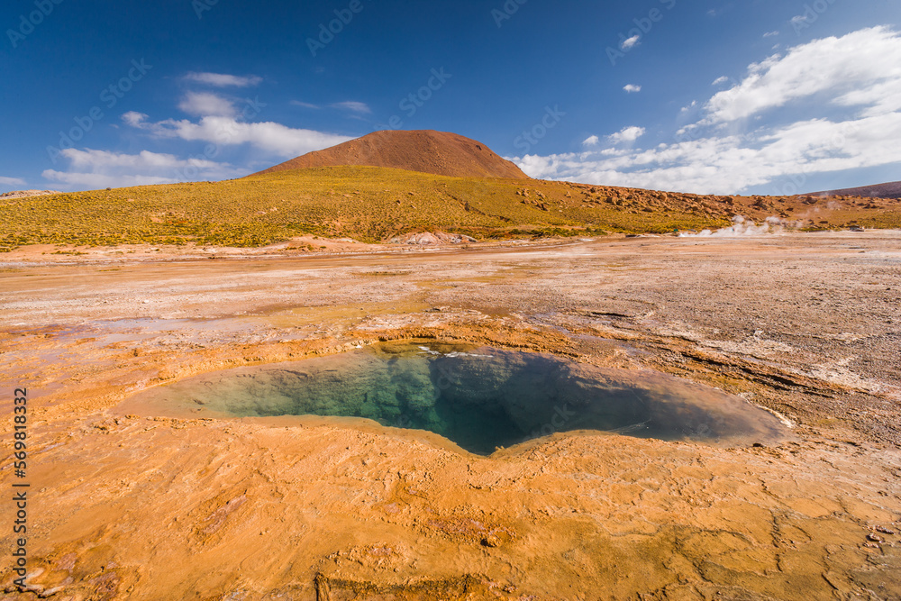 Landscape with hot spring on the El Tatio geyser field in the Andes mountain range in the north of Chile
