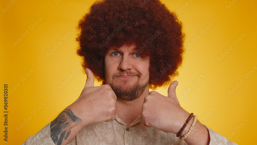 I am the best, choose me. Happy bearded man with lush Afro hairstyle coiffure feeling very proud pointing hisself, looking self-confident, overjoyed by success. Young hipster guy on yellow background I am the best, choose me. Happy bearded man with lush Afro hairstyle coiffure feeling very proud pointing hisself, looking self-confident, overjoyed by success. Young hipster guy on yellow background