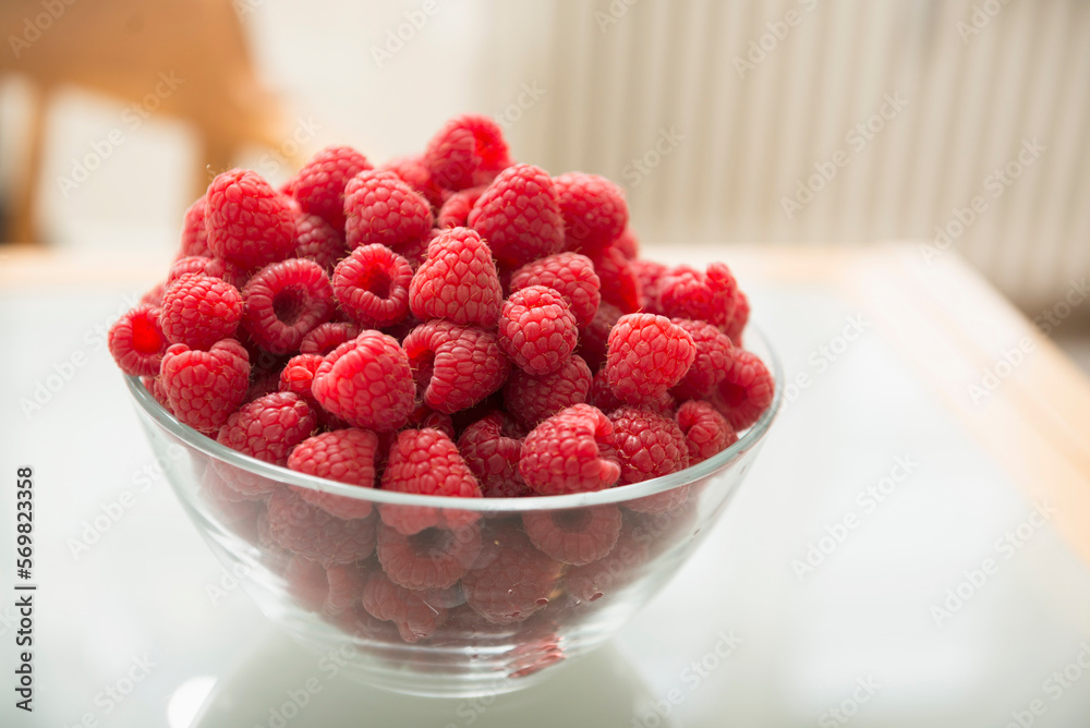 Raspberries in glass bowl on table, Munich, Bavaria, Germany Raspberries in glass bowl on table, Munich, Bavaria, Germany