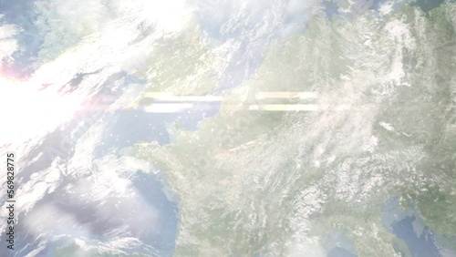 Earth zoom in from outer space to city. Zooming on Fleurus, Belgium. The animation continues by zoom out through clouds and atmosphere into space. Images from NASA photo