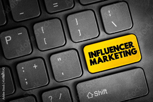 Influencer marketing - form of social media marketing involving endorsements and product placement from influencers, people and organizations, text button on keyboard photo