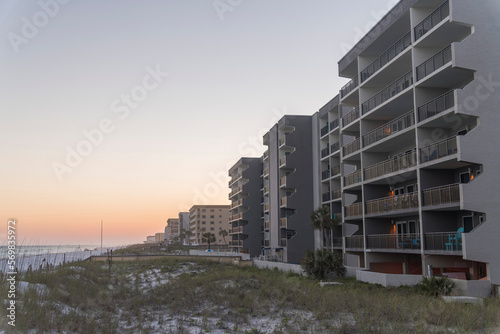 Fotografia, Obraz Row of beachfront hotels apartments with views of sunset horizon skyline at Destin, Florida