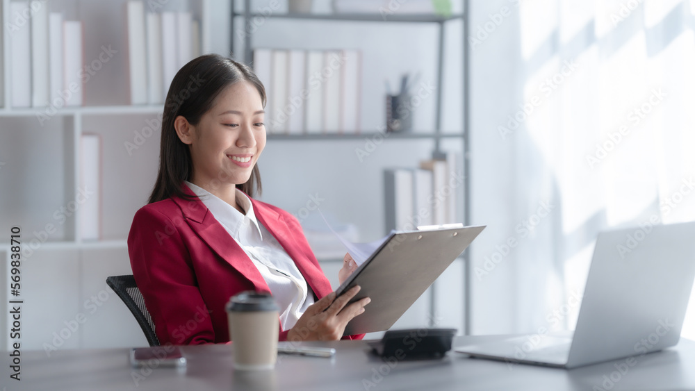 Young pretty attractive asia chinese half thai woman mixed race working with online balance sheet outsource, online bookkeepers helpful consult customized accounting reports and financial statements. Young pretty attractive asia chinese half thai woman mixed race working with online balance sheet outsource, online bookkeepers helpful consult customized accounting reports and financial statements.