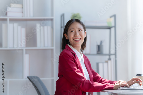 Young pretty attractive asia chinese half thai woman mixed race working with online balance sheet outsource, online bookkeepers helpful consult customized accounting reports and financial statements.