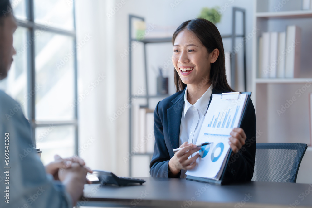 Meeting and consulting agenda of indian asia mixed race business man and female china half thai ethnicity bookkeepers discussing assets, balance sheet, stock market profit with yearly tax.