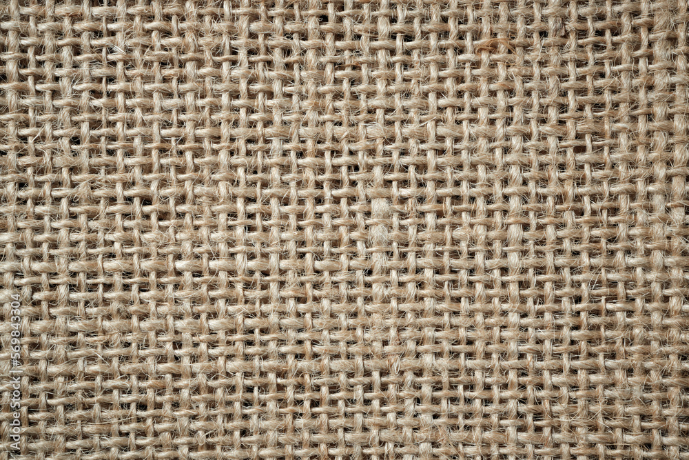 Abstract background close-up of burlap fabric. Space for lettering or design Abstract background close-up of burlap fabric. Space for lettering or design