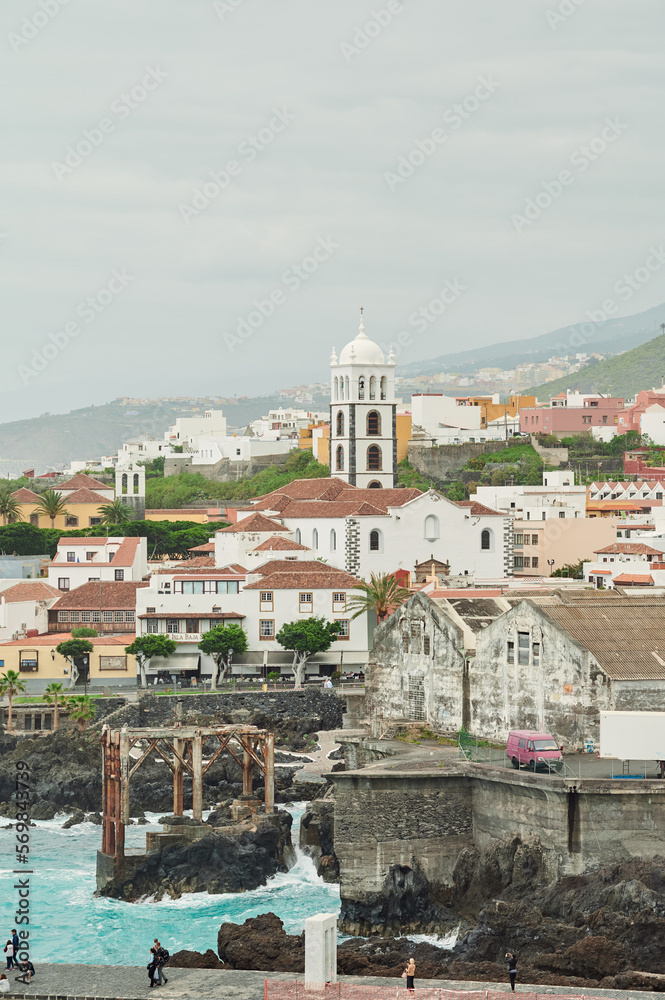 Picturesque view of coastal town with church in Tenerife